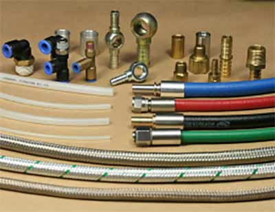 Collection of hoses and connectors on a wooden surface